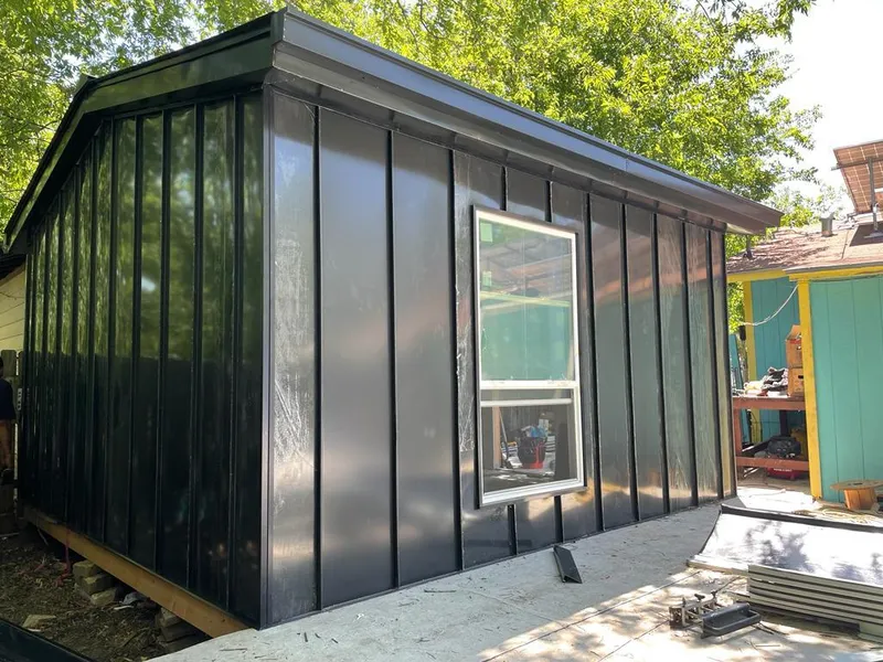 Black standing seam metal wall panels for Metal Roof Installation in Saginaw